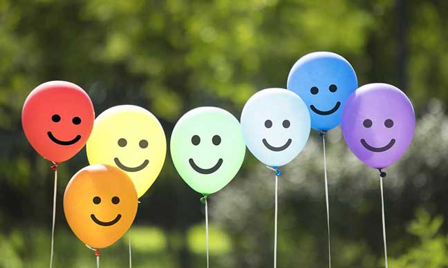 Balloons with smiling faces on them